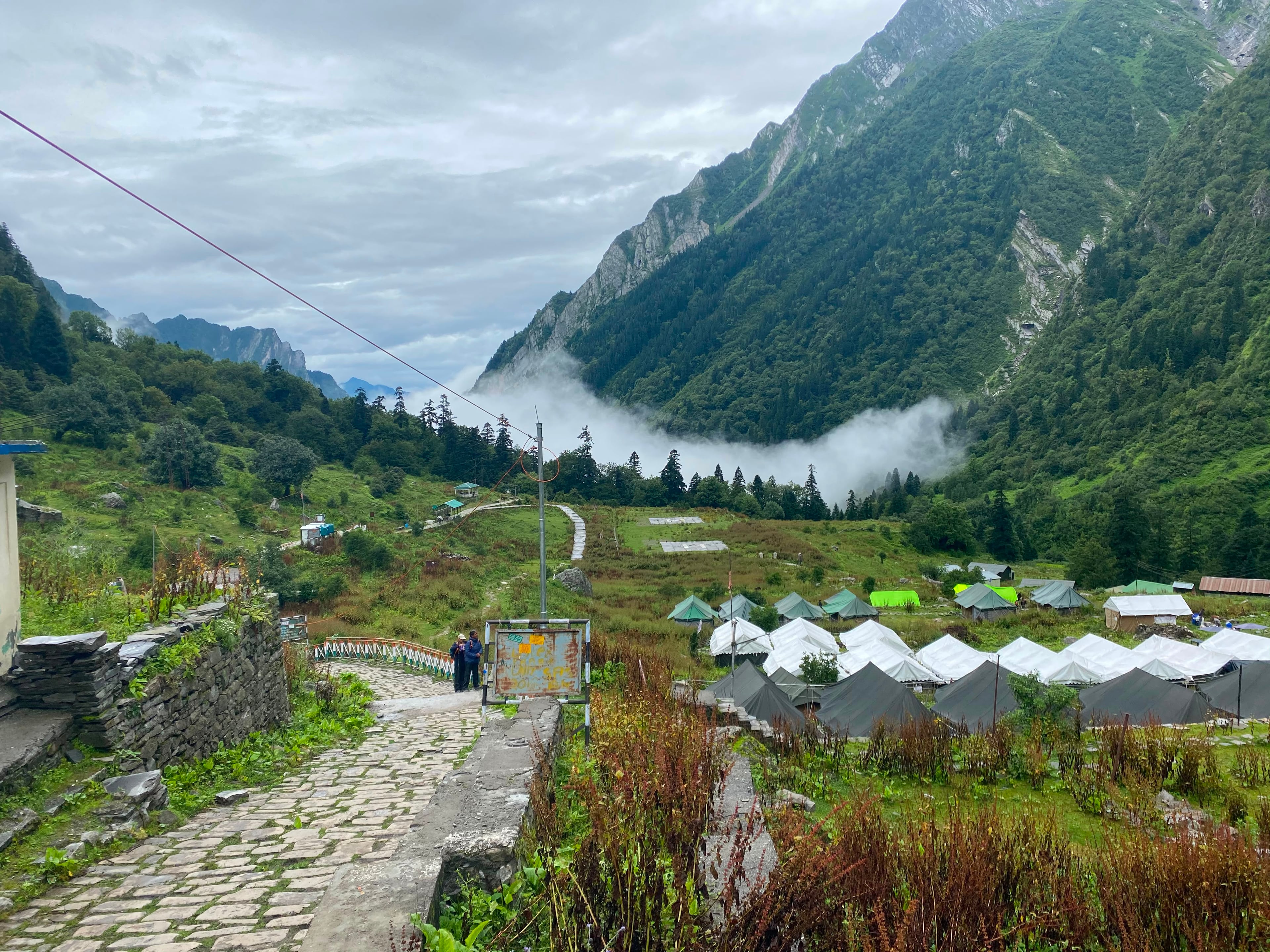 Stone trail through a misty Himalayan valley in Uttarakhand